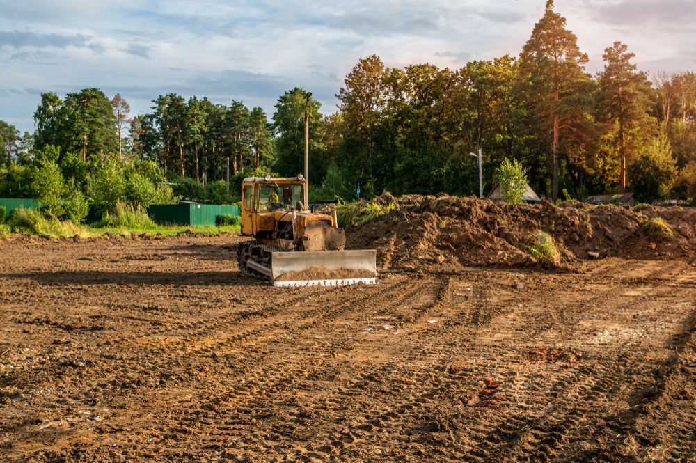 Land clearing and excavator